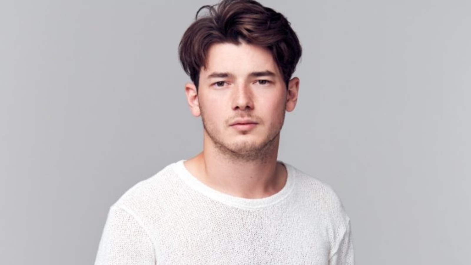 Demo attachment 1568 studio portrait of young man with serious 8YSPPQM
